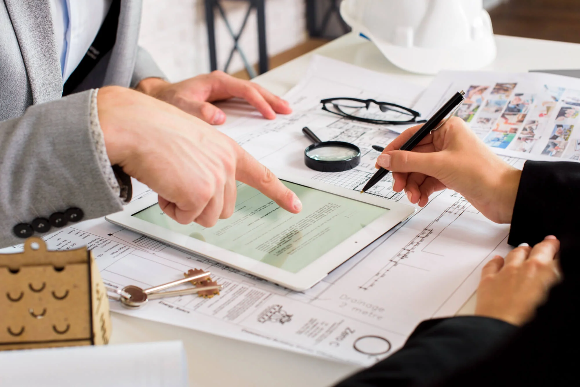 Financial advisor reviewing financial documents with a client